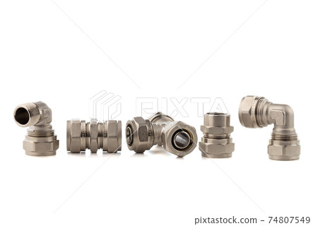 Fittings for water on a white background. Brass fittings close-up. Fittings for water on a white background. Brass fittings close-up. 74807549