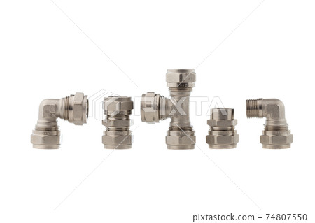 Fittings for water on a white background. Brass fittings close-up. Fittings for water on a white background. Brass fittings close-up. 74807550