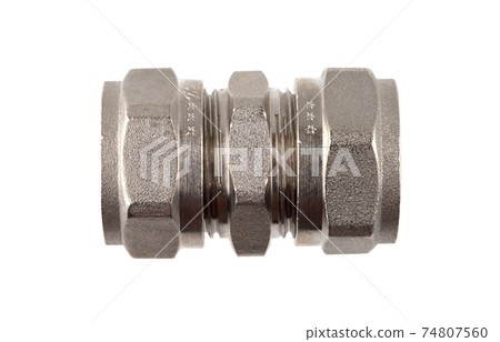 Water fitting on a white background. Brass fitting close-up. Water fitting on a white background. Brass fitting close-up. 74807560
