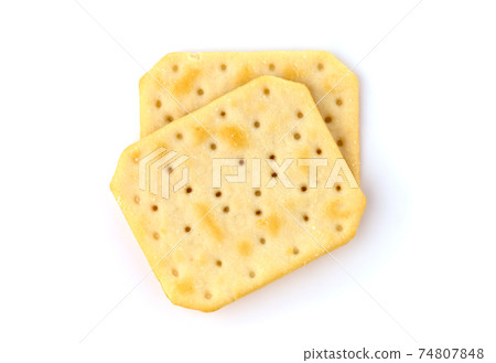 Crackers on a white background. Salty crackers close up on a white background. Crackers on a white background. Salty crackers close up on a white background. 74807848