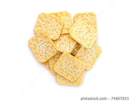 Crackers on a white background. Salty crackers close up on a white background. 74807853