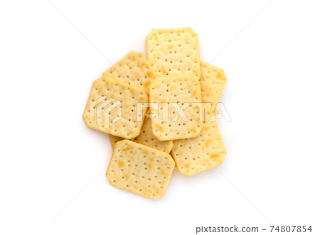 Crackers on a white background. Salty crackers close up on a white background. Crackers on a white background. Salty crackers close up on a white background. 74807854