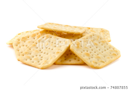 Crackers on a white background. Salty crackers close up on a white background. Crackers on a white background. Salty crackers close up on a white background. 74807855