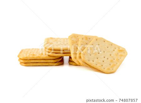 Crackers on a white background. Salty crackers close up on a white background. Crackers on a white background. Salty crackers close up on a white background. 74807857