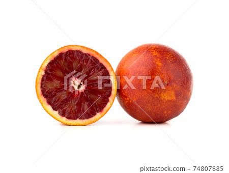 Bloody orange on a white background. Red orange and slice on a white background. 74807885