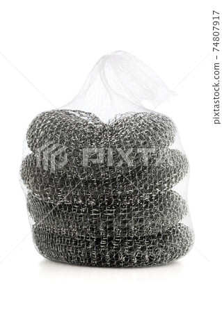 Iron brush for washing dishes. Several iron brushes close-up on a white background. 74807917