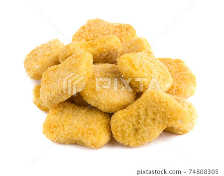 Frozen nuggets on a white background. Several chicken nuggets in breading close-up on a white background. Frozen nuggets on a white background. Several chicken nuggets in breading close-up on a white background. 74808305