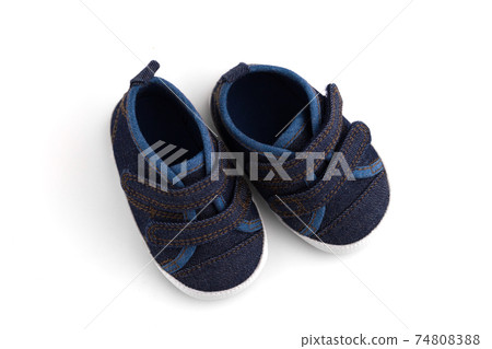 Children's sneakers on a white background. Footwear for babies close up. Children's sneakers on a white background. Footwear for babies close up. 74808388