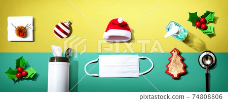 Prevent virus and germs concept with Christmas ornaments Prevent virus and germs concept with Christmas ornaments 74808806