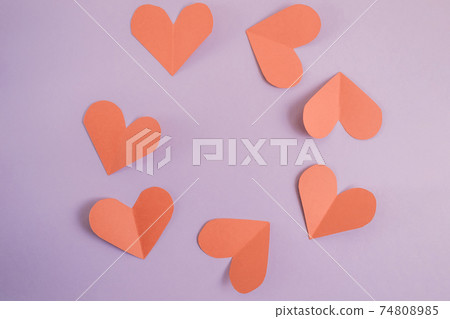 Valentine's day background. Red hearts laid out in a circle on a pastel purple background. Valentine's day concept. Layout for postcards and congratulations. Flat lay, top view, copy space Valentine's day background. Red hearts laid out in a circle on a pastel purple background. Valentine's day concept. Layout for postcards and congratulations. Flat lay, top view, copy space 74808985