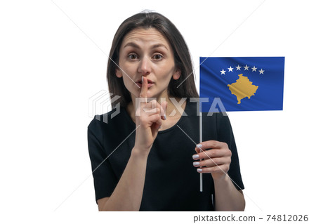 Happy young white woman holding flag of Kosovo and holds a finger to her lips isolated on a white background Happy young white woman holding flag of Kosovo and holds a finger to her lips isolated on a white background 74812026