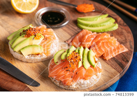 Puffed rice spread with raw salmon and avocado Puffed rice spread with raw salmon and avocado 74813399