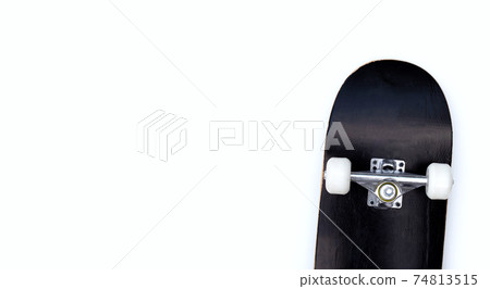Black skateboard on white background. 74813515