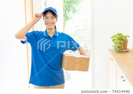 Courier female driver delivering luggage 74814490