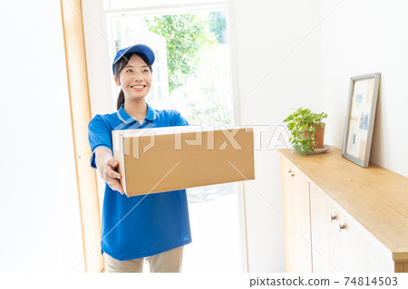 Courier female driver delivering luggage Courier female driver delivering luggage 74814503