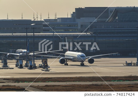 Airport at dusk Taxiing airplane Ota-ku, Tokyo 74817424
