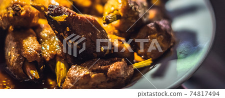 BANNER Close-up spicy asia or korean fried in oil soy meat vegan food. Photo use as design dark background for restaurant, street meal, healthy unhealthy dish concept. Yellow colour 74817494