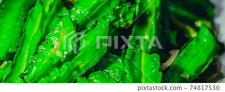 BANNER Spicy asia vegan vegetable salad food with fresh fried dragon grass. Photo use as design background for restaurant, street meal, healthy unhealthy dish concept. Bright Green tone colour 74817530