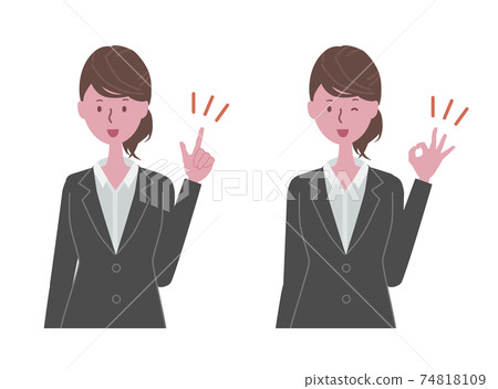 A woman in a black suit pointing her finger and giving an OK sign A woman in a black suit pointing her finger and giving an OK sign 74818109
