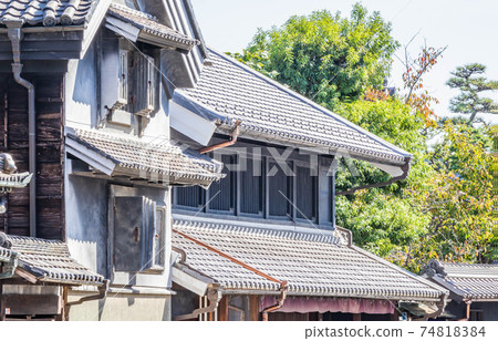 An old Japanese house with a black-walled storehouse An old Japanese house with a black-walled storehouse 74818384