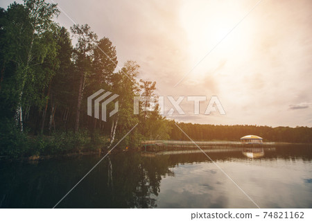 fishing bridge by the river. docks for boats on the lake. water and transport 74821162