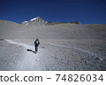 Hiker walking on trekking route on mountain 74826034