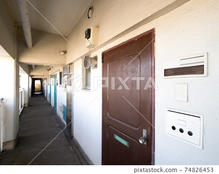 Corridor of old housing complex 74826453