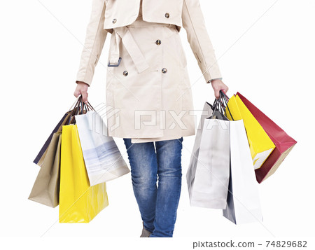 woman walking with colorful shopping bags, studio shot, isolated on white woman walking with colorful shopping bags, studio shot, isolated on white 74829682