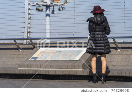 Airport scenery: A woman who sees off an airplane that has taken off, Ota-ku, Tokyo Airport scenery: A woman who sees off an airplane that has taken off, Ota-ku, Tokyo 74829698