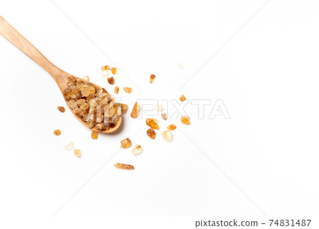 brown sugar on wooden spoon isolated on white background , top view , flat lay. brown sugar on wooden spoon isolated on white background , top view , flat lay. 74831487