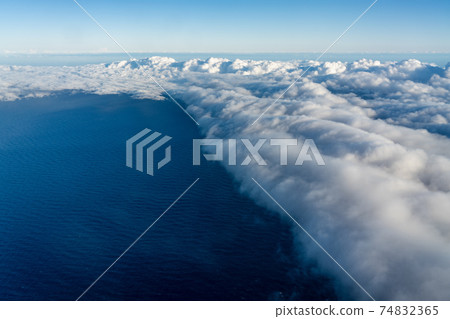 Large cumulonimbus clouds over the ocean 74832365