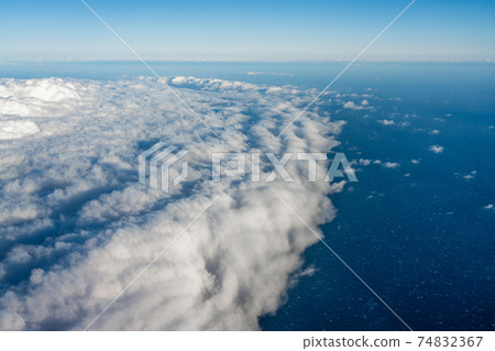 Large cumulonimbus clouds over the ocean 74832367