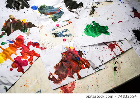 many red colored blots on white paper with streaks 74832554