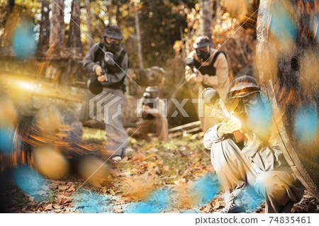 Paintball team aiming outdoors 74835461