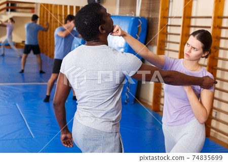 People practicing self defense techniques People practicing self defense techniques 74835699