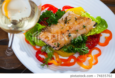 Tasty tender fried trout fillet Tasty tender fried trout fillet 74835702