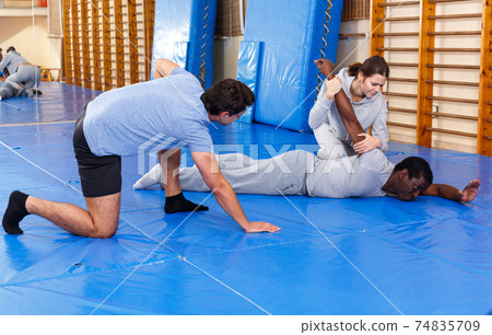 People fighting with coach at gym 74835709