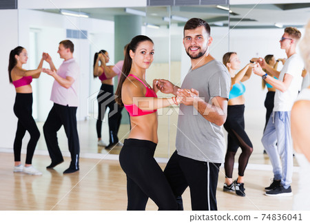 couples enjoying of partner dance couples enjoying of partner dance 74836041