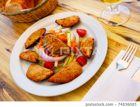 Gratin of mussels served with vegetable salad Gratin of mussels served with vegetable salad 74836085