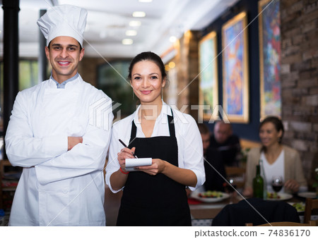 Waitress with chef in restaurant Waitress with chef in restaurant 74836170