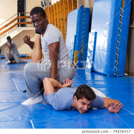 Two men practicing self defense techniques Two men practicing self defense techniques 74836437