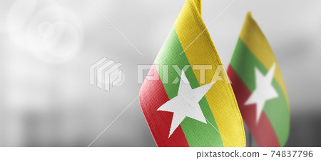 Small national flags of the Myanmar on a light blurry background 74837796