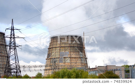 old large pipes with steam, smoke the plant, cloudy day 74839924