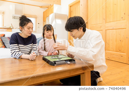 Home time, refraining from going out Parents and children enjoying Othello at home 74840496