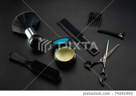 Barber shop equipment set isolated on black table background. Barber shop equipment set isolated on black table background. 74842993