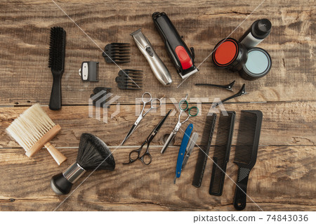 Barber shop equipment set isolated on wooden table background. 74843036