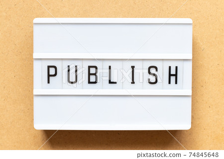 Lightbox with word publish on wood background 74845648