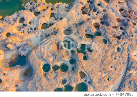 Aerial view of Sam Phan Bok, Ubon Ratchathani, Thailand. Dry rock reef in the Mekong River. Nature landscape background. Grand Canyon of Thailand. Aerial view of Sam Phan Bok, Ubon Ratchathani, Thailand. Dry rock reef in the Mekong River. Nature landscape background. Grand Canyon of Thailand. 74847093