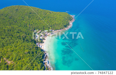 Aerial view of Koh Larn beach, Pattaya with blue turquoise seawater, mountain hills, and tropical green forest trees with Andaman sea in island in summer, Thailand in travel trip. Nature background. Aerial view of Koh Larn beach, Pattaya with blue turquoise seawater, mountain hills, and tropical green forest trees with Andaman sea in island in summer, Thailand in travel trip. Nature background. 74847122
