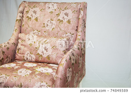 Vintage furniture: reclining chair made of fabric, on a light background. Vintage furniture: reclining chair made of fabric, on a light background. 74849389